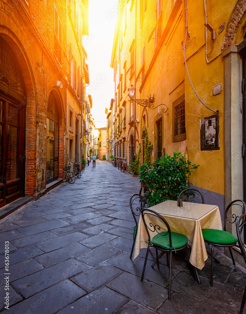 Narrow old cozy street in Lucca, Italy - obrazy, fototapety, plakaty 