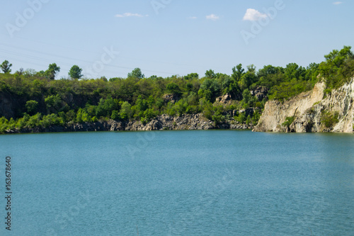 Lake at abandoned quarry © olyasolodenko