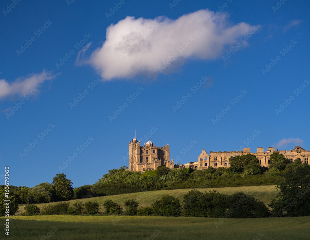 Bolsover Castle in Sunlight with Blue Sky and White Fluffy Clouds