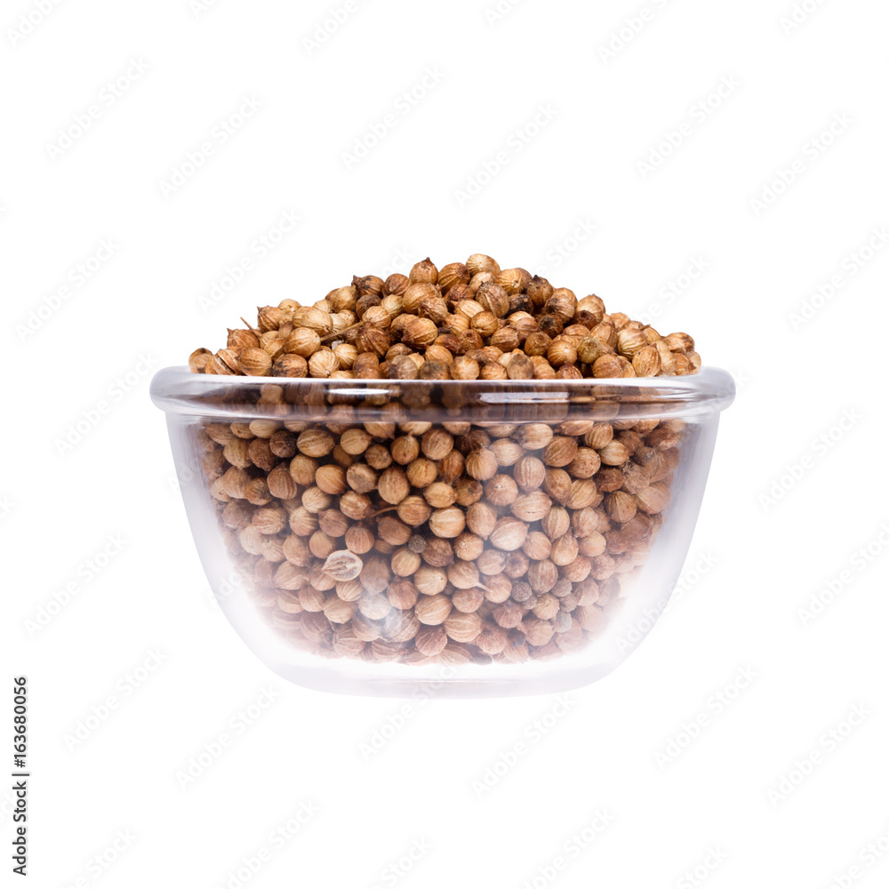 White background with saucepan full of hazelnuts. Macro shot. White background with saucepan full of hazelnuts. Macro shot.