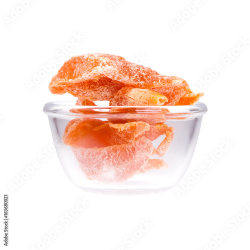 Dried tangerine in saucepan on white mackground. photo