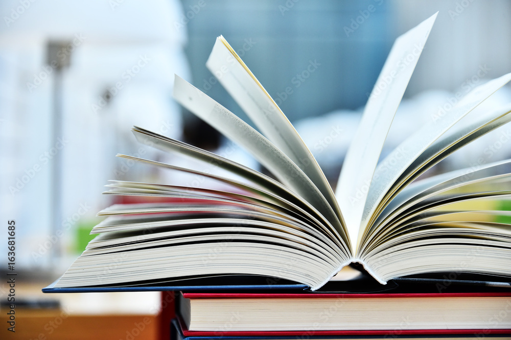Fototapeta premium Books lying on the table in the public library