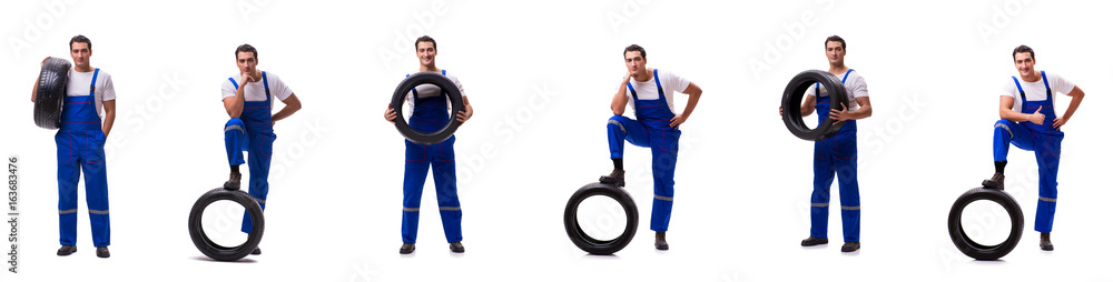 Handsome tyre repairman isolated on white Handsome tyre repairman isolated on white