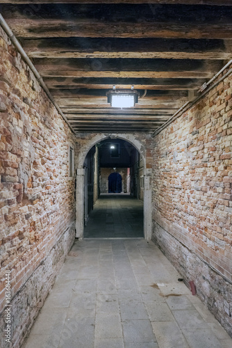 Strait tunnel very lonely in the oldest part of the city in Venice  Italy