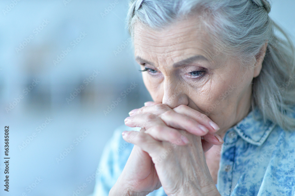 Beautiful sad elderly woman close-up
