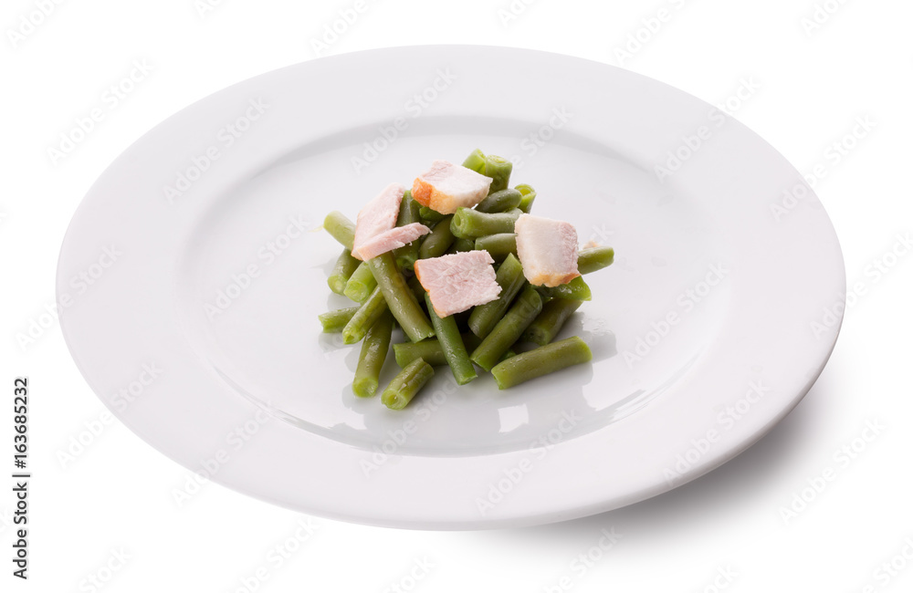 green bean haricot with meat slices on a plate