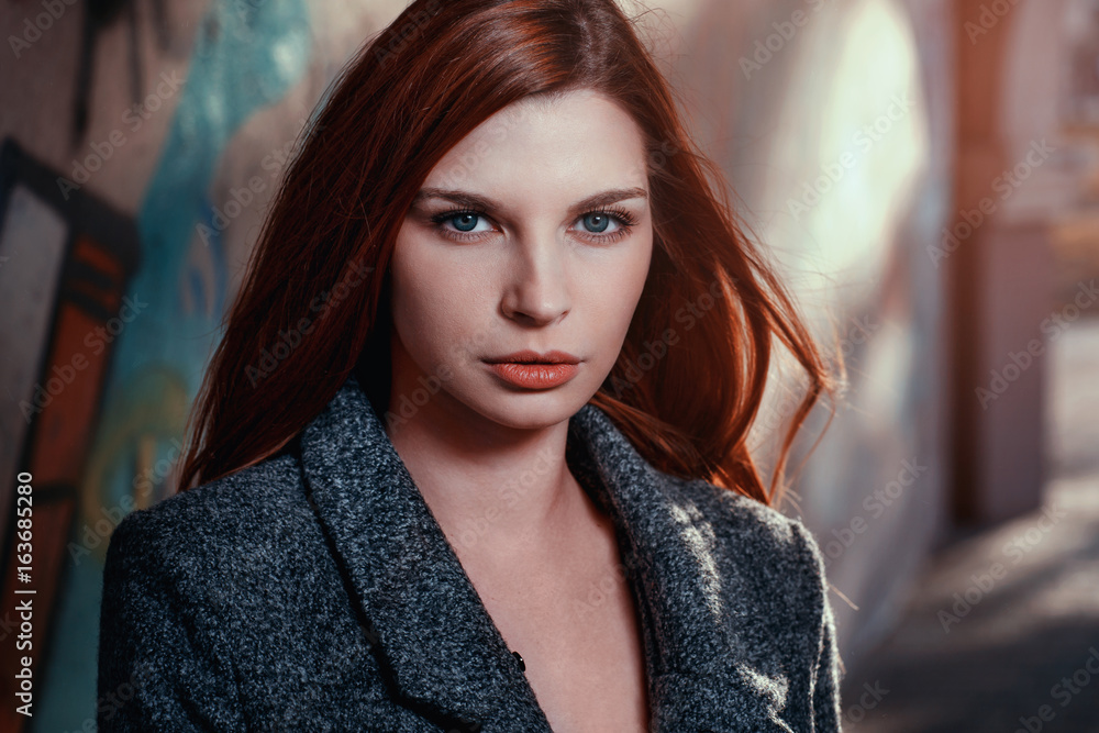 Portrait of a young beautiful girl closeup. View of the model is directed to camera Portrait of a young beautiful girl closeup. View of the model is directed to camera