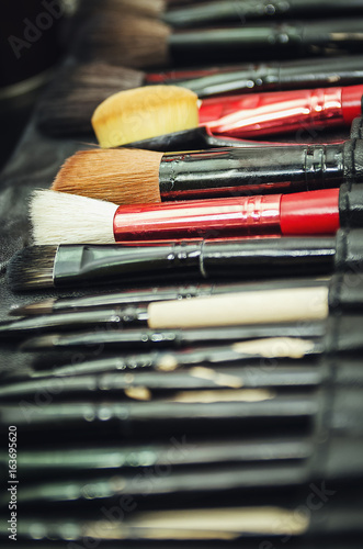 Closeup of professional makeup tools in their holder. Brushes to create makeup.