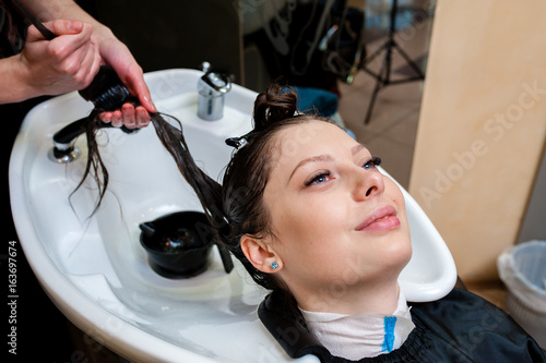 Beautiful girl washing their hair. photo