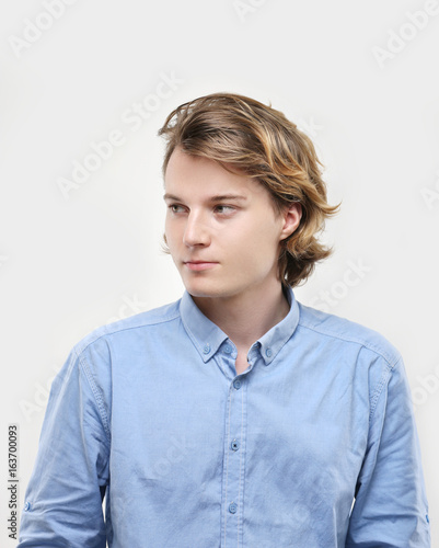 Attractive teenage boy,gray background