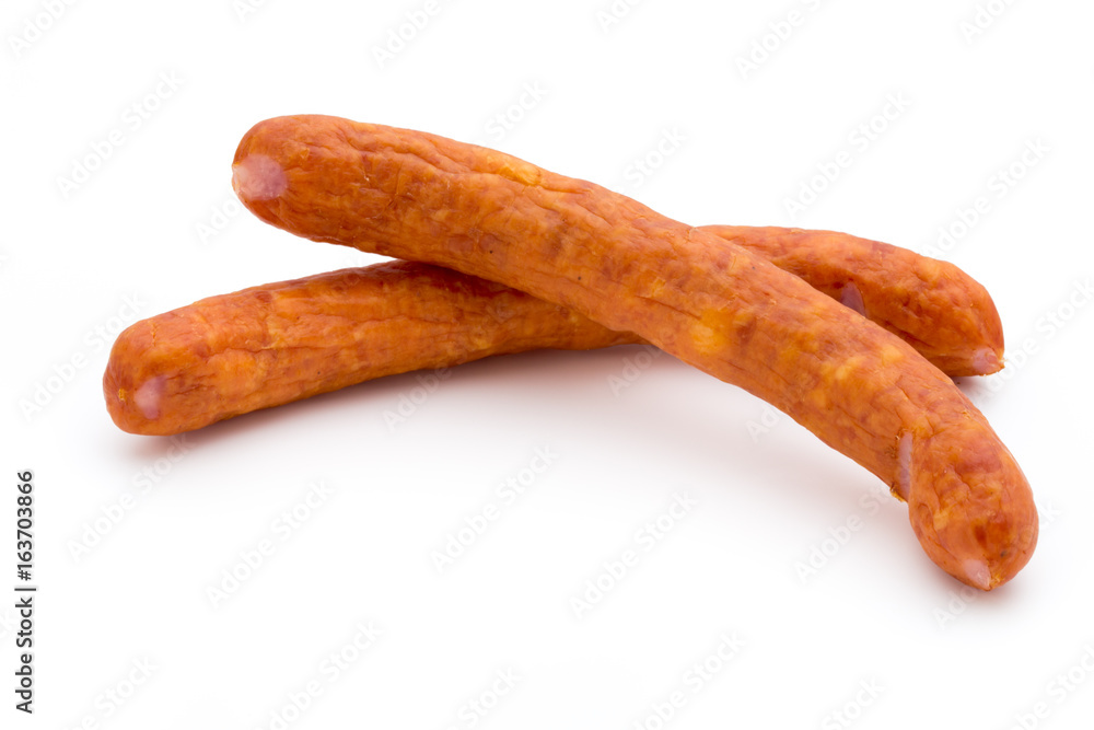 Stack of smoked sausages isolated on a white background. Stack of smoked sausages isolated on a white background.