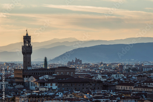 Florence townhall with mountains in the background and view of the city from Piazzale Michelangelo, at sunset