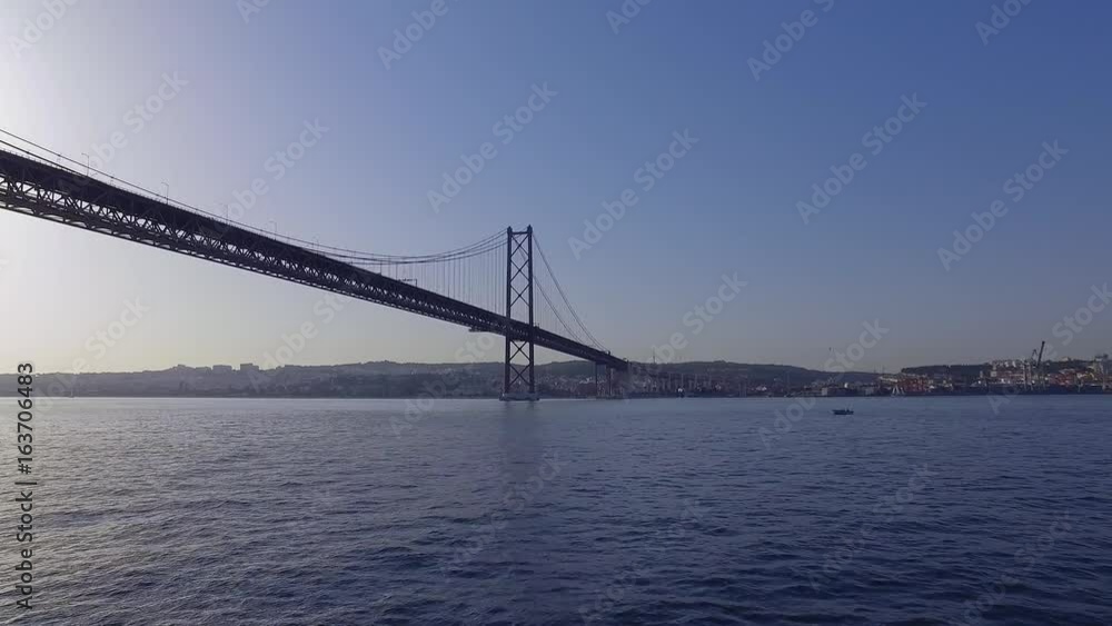 Famous 25th April Bridge over River Tajo in Lisbon aka Salazar Bridge Famous 25th April Bridge over River Tajo in Lisbon aka Salazar Bridge