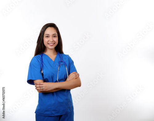 Smiling Nurse in Blue Scrubs