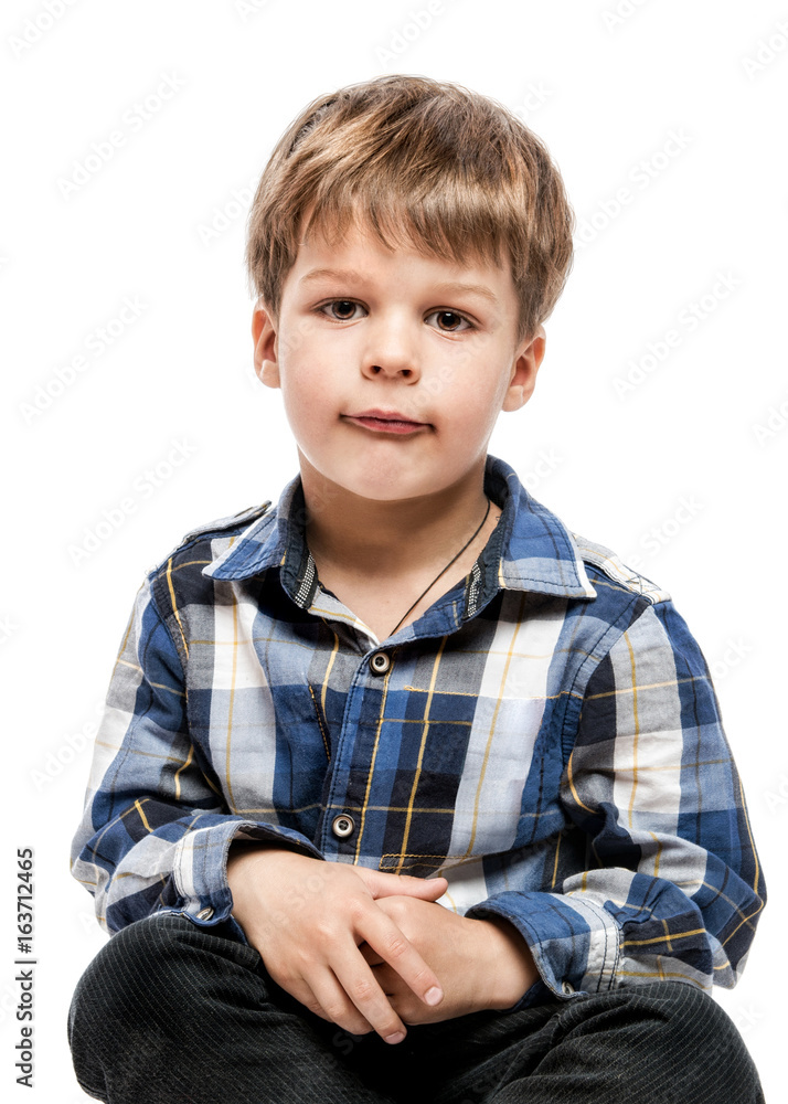 Cute little boy in casual squares shirt on white Cute little boy in casual squares shirt on white