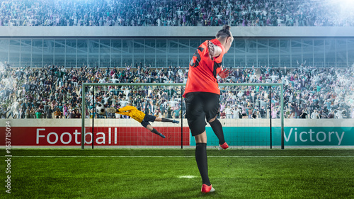 female soccer player taking penalty on crowded stadium