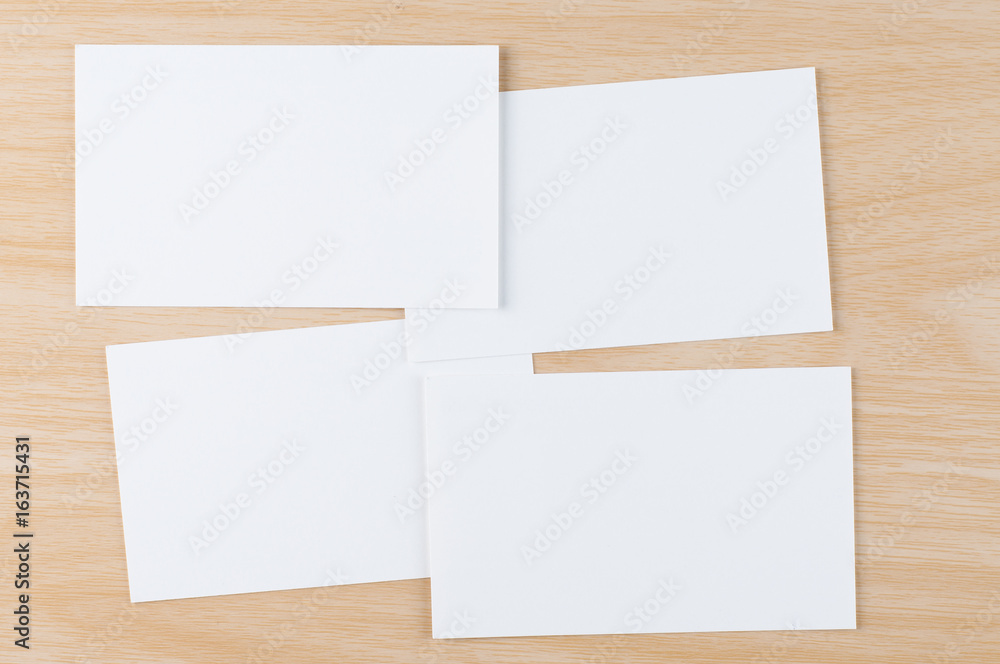 white blank business card on the wooden office desk white blank business card on the wooden office desk