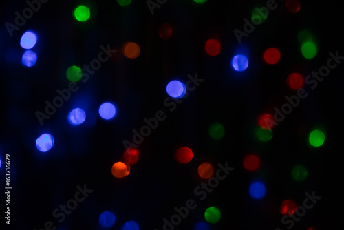 Colorful bokeh on black background.