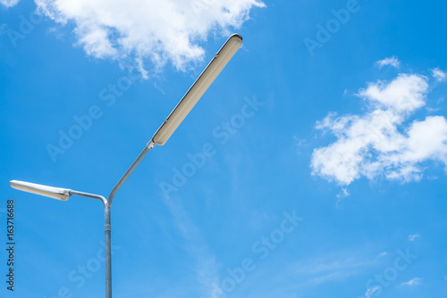 Steet lamp post with blue sku background.