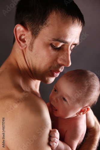 newborn baby with handsome father 