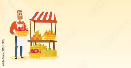 Greengrocer holding box full of apples.