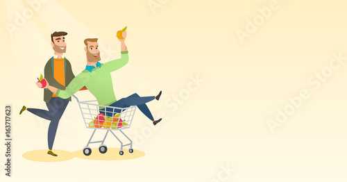 Couple of friends riding in shopping trolley.