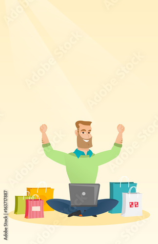 Caucasian man using a laptop for online shopping.