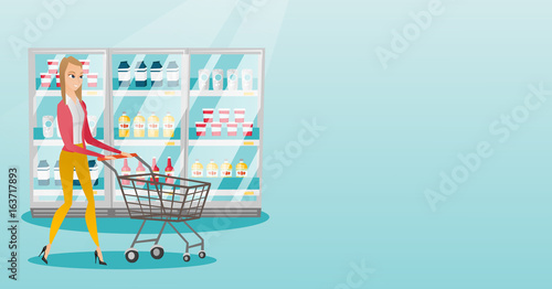 Young caucasian woman with supermarket trolley.