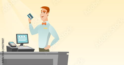 Caucasian cashier holding a credit card.