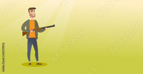 Young caucasian hunter holding a hunting rifle.