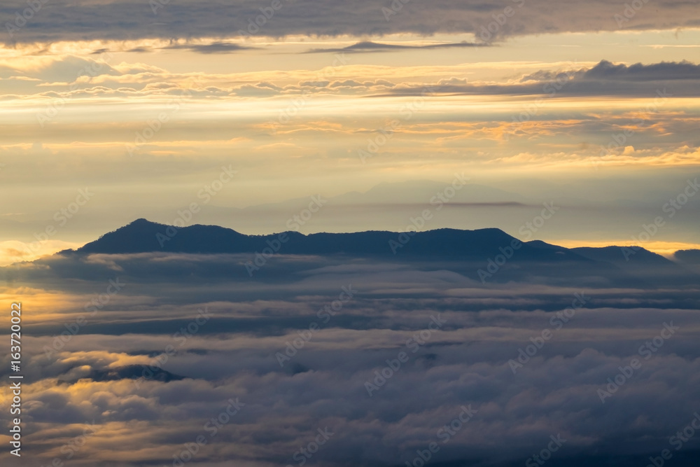 Heaven mountain in morning sun ray and winter fog.