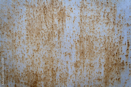 Colored rusty metal iron wall background. Abstract canvas with spots