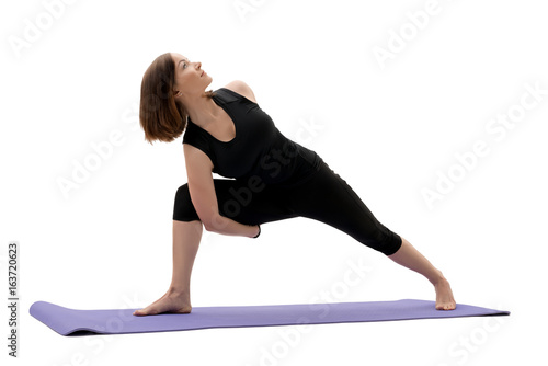 Woman doing sports exercises in studio isolated shot