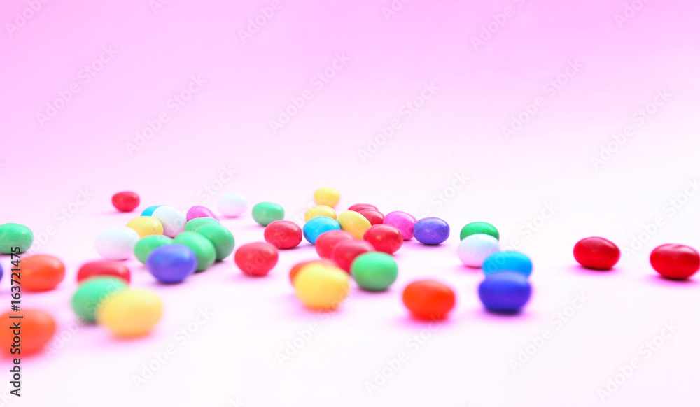 Colorful candies on pink Colorful candies on pink