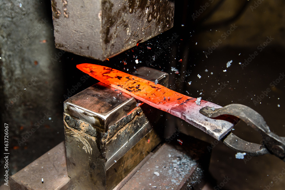 Forging molten metal. Making knives. Forging molten metal. Making knives.