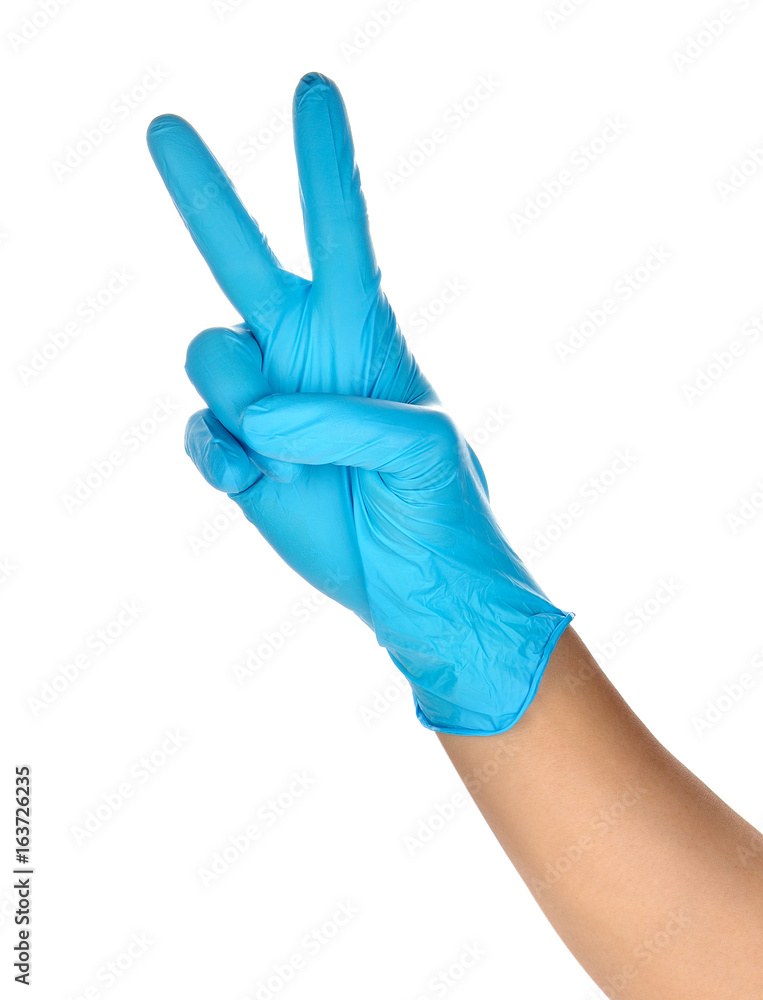 Hand of a medic wearing a blue latex gloves Hand of a medic wearing a blue latex gloves
