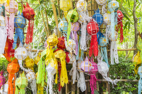 colorful paper, textiles and bamboo lamp lighting and decoration flags made with THAI traditional handmade craft style for modern usage as street decoration in LOY KRATHONG festival in THAILAND