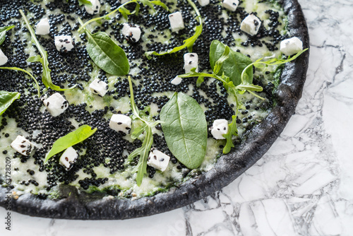 pizza with black caviar