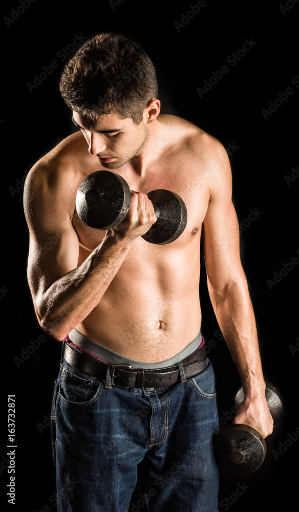 Young Man Working Out Biceps - Dumbbell Concentration Curl