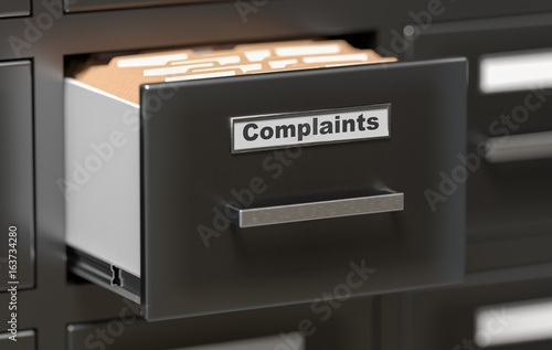 фотографія Complaints files and documents in cabinet in office