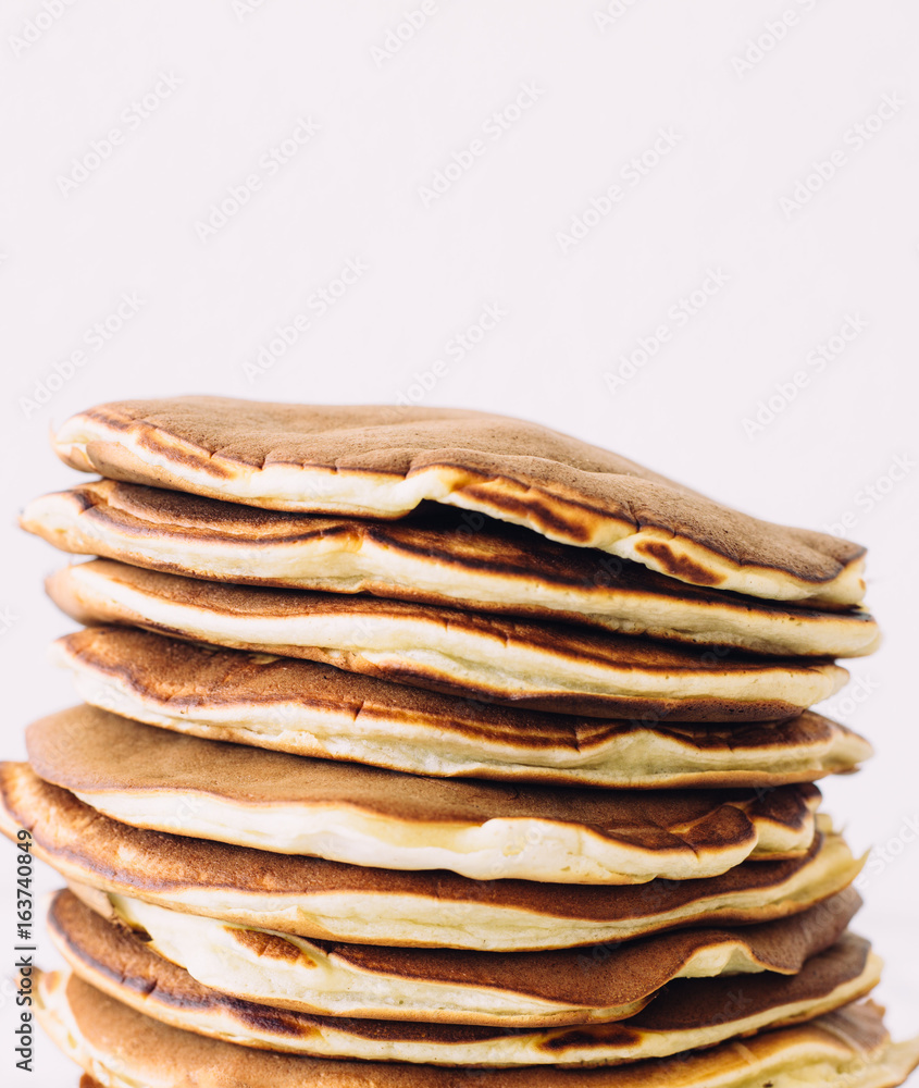 Delicious pancakes on white background. Morning and breakfast concept Delicious pancakes on white background. Morning and breakfast concept