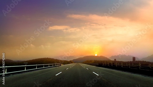 Fotografie Empty open road during sunset