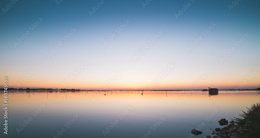 Calm sunset at a laguna in italy