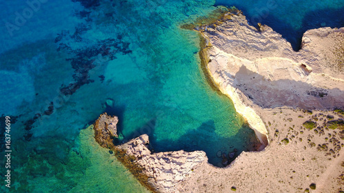 Aerial drone photo of famous caves near Pori beach, Koufonissi island. Cyclades, Greece