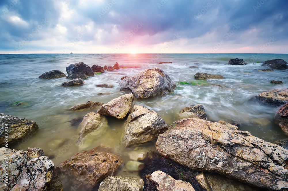 Beautiful seascape. Stones on sea shore. Nature composition.
