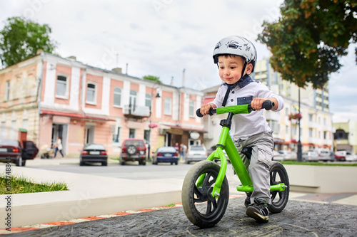 boy in a helmet riding bike © Aleksey