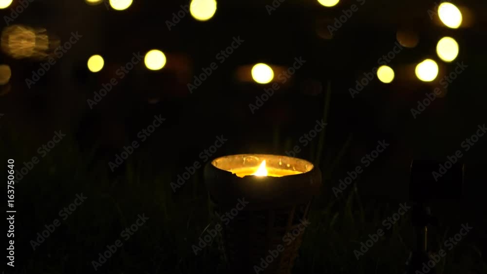 ight the candle lights a Bokeh background. ight the candle lights a Bokeh background.