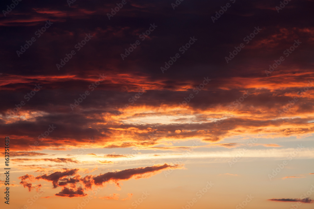 Gray, red and orange clouds in the sky