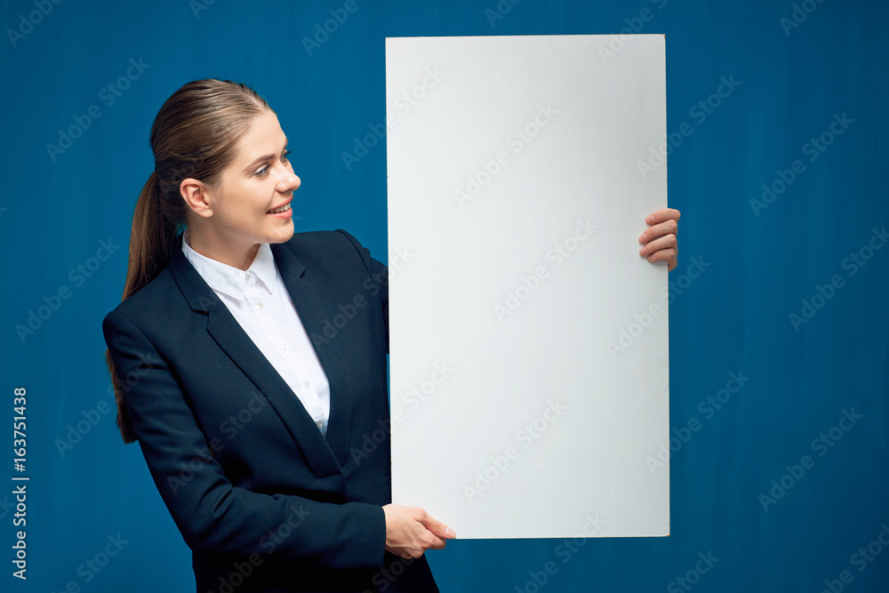 Smiling business woman holding sign card. Smiling business woman holding sign card.