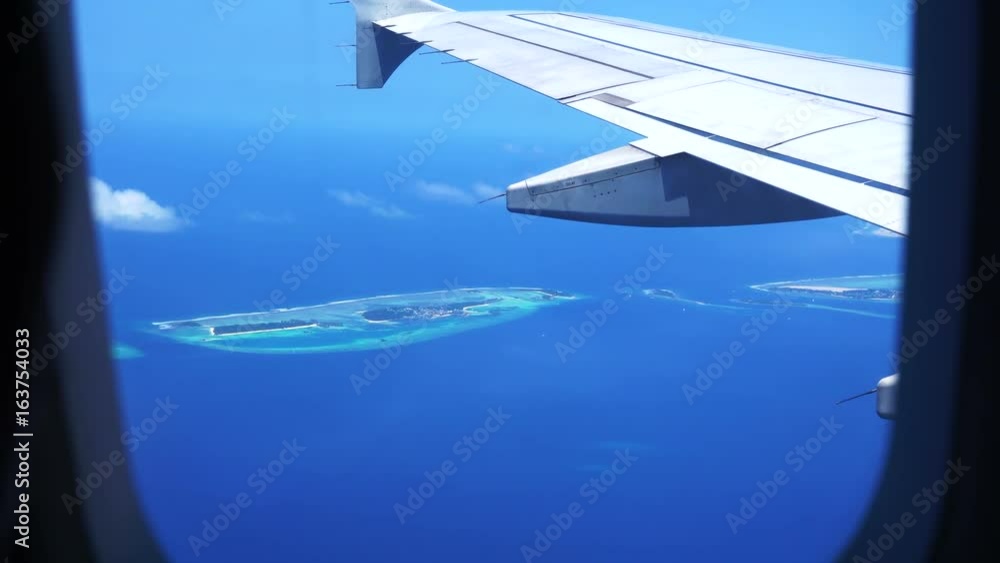 Maldives Islands from plane aerial view, Travel holiday destination paradise view 4k Maldives Islands from plane aerial view, Travel holiday destination paradise view 4k